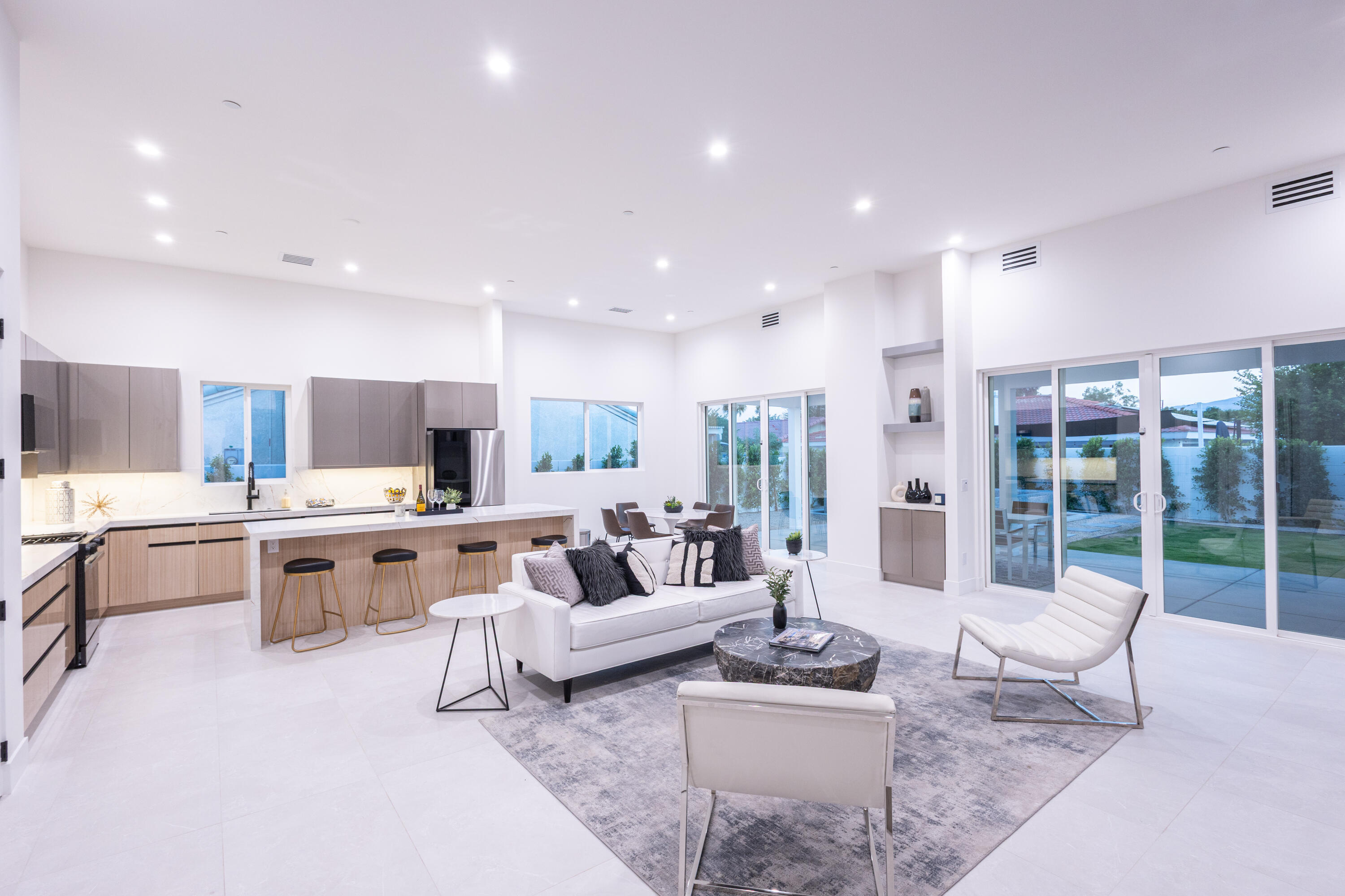67385 Ovante Road Cathedral City, CA 92234 - Photo 3 of 32 a living room with furniture kitchen view and a large window