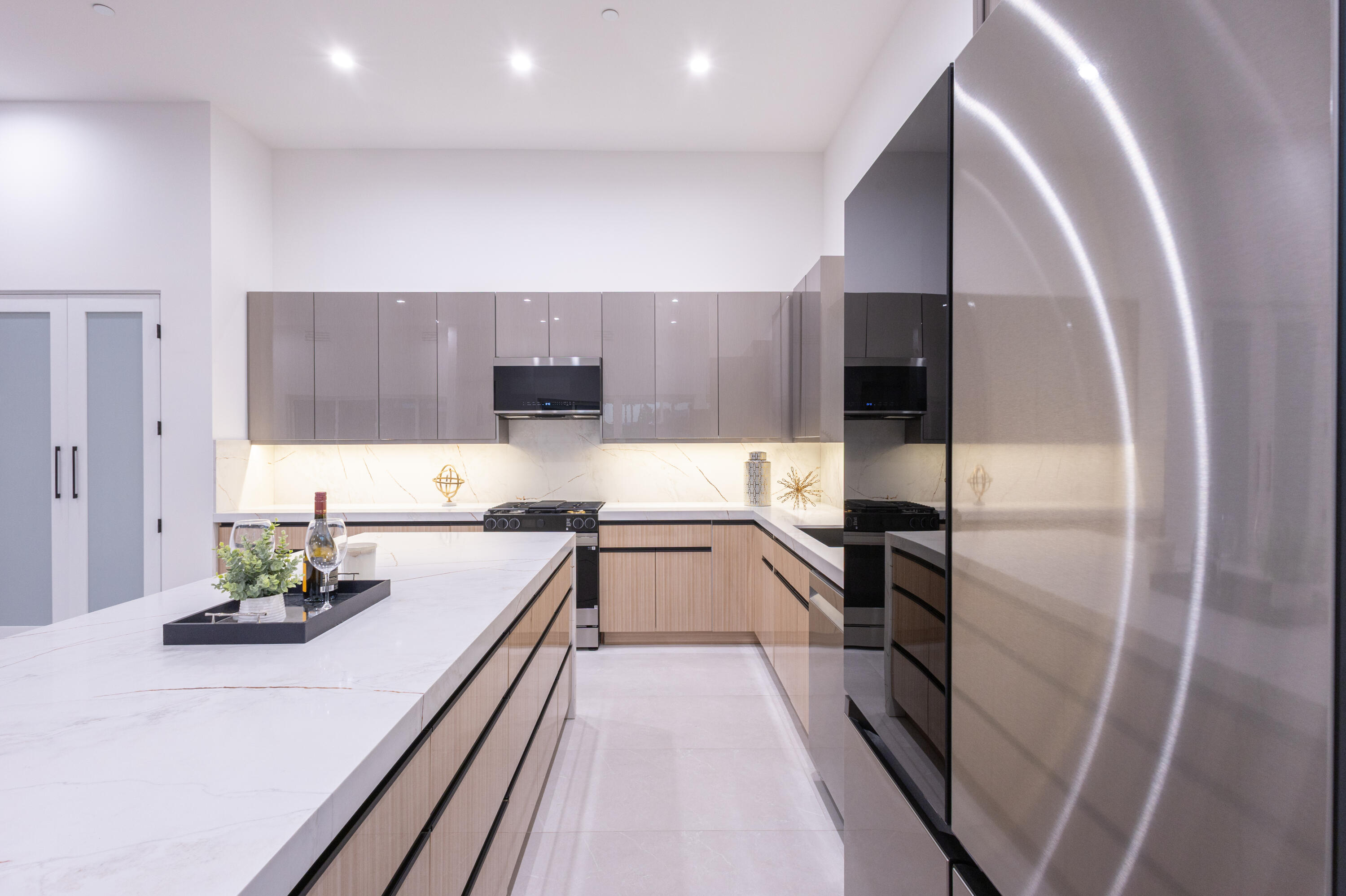 67385 Ovante Road Cathedral City, CA 92234 - Photo 10 of 32 a kitchen with stainless steel appliances a refrigerator sink and stove