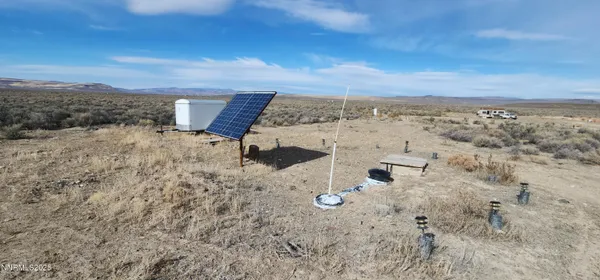 a view of water heater and wooden floor
