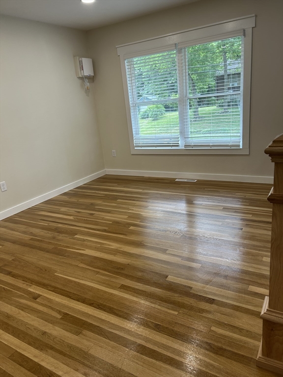 61 Esta Road Plymouth, MA 02360 - Photo 19 of 40 an empty room with wooden floor and windows