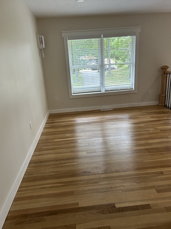 61 Esta Road Plymouth, MA 02360 - Photo 20 of 40 a view of an empty room with wooden floor and a window