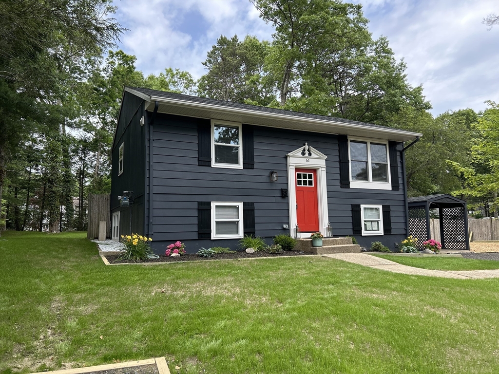 61 Esta Road Plymouth, MA 02360 - Photo 2 of 40 a front view of a house with garden
