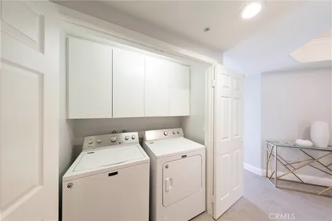 a view of storage and utility room with washer and dryer