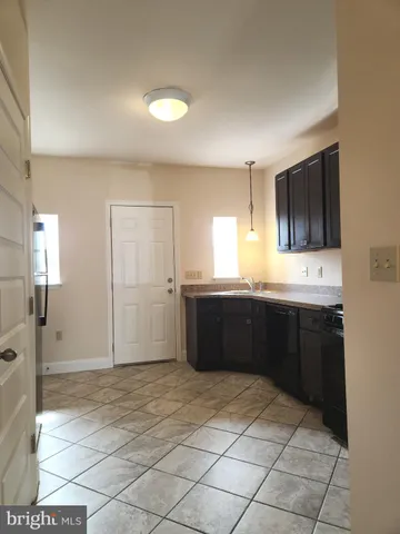 a large bathroom with a sink and a large mirror