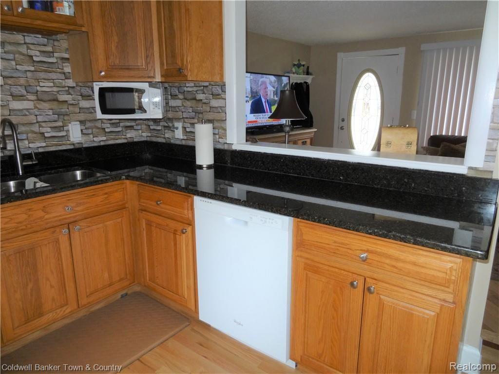 223 Ruppert Street Commerce Township, MI 48382 - Photo 13 of 31 Kitchen open to living room.