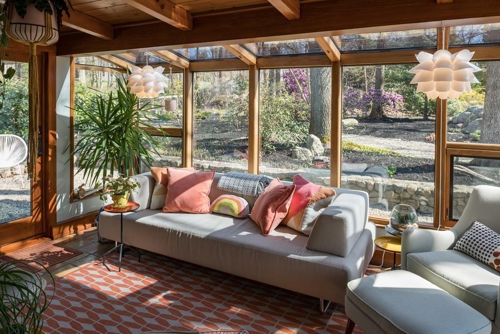 25 Rockwood Road Hingham, MA 02043 - Photo 12 of 34 a living room with furniture and a floor to ceiling window