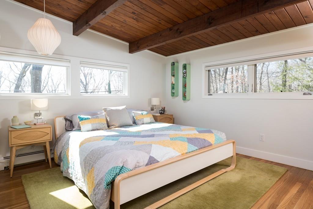 25 Rockwood Road Hingham, MA 02043 - Photo 17 of 34 a bed sitting in a bedroom next to a window