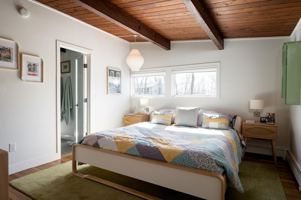 25 Rockwood Road Hingham, MA 02043 - Photo 19 of 34 a bedroom with a bed and a dresser