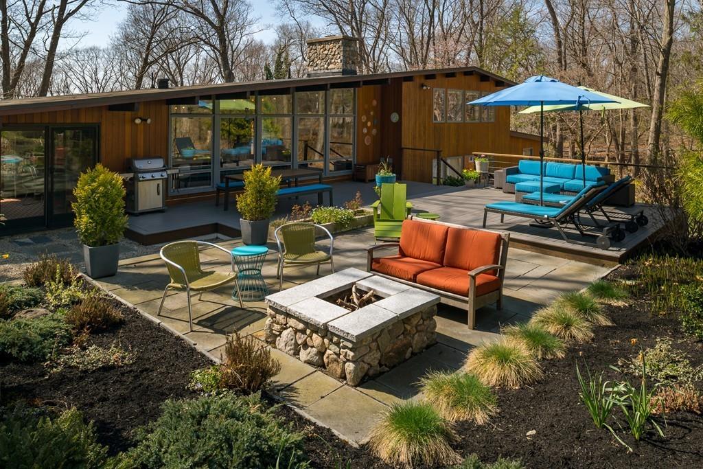 25 Rockwood Road Hingham, MA 02043 - Photo 2 of 34 a backyard of a house with barbeque oven table and chairs