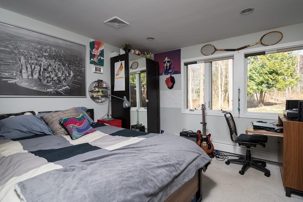 25 Rockwood Road Hingham, MA 02043 - Photo 24 of 34 a bedroom with a bed and a large window