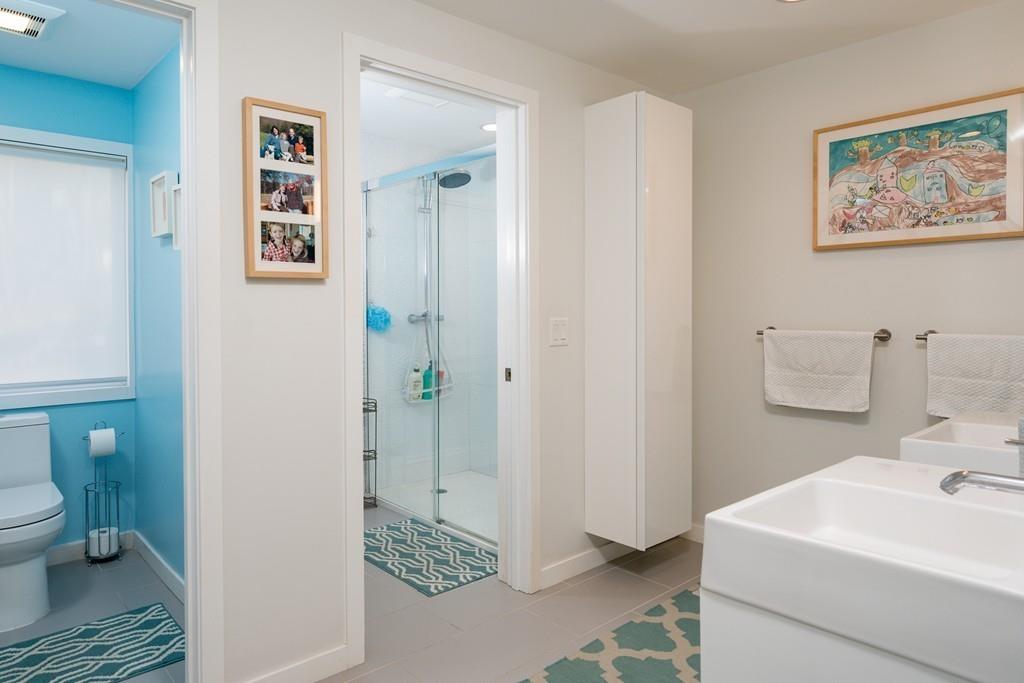 25 Rockwood Road Hingham, MA 02043 - Photo 25 of 34 a bathroom with a sink a toilet and a view of bathroom