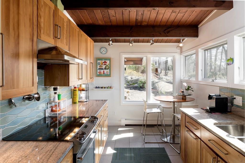 25 Rockwood Road Hingham, MA 02043 - Photo 3 of 34 a kitchen with stainless steel appliances granite countertop a sink and cabinets