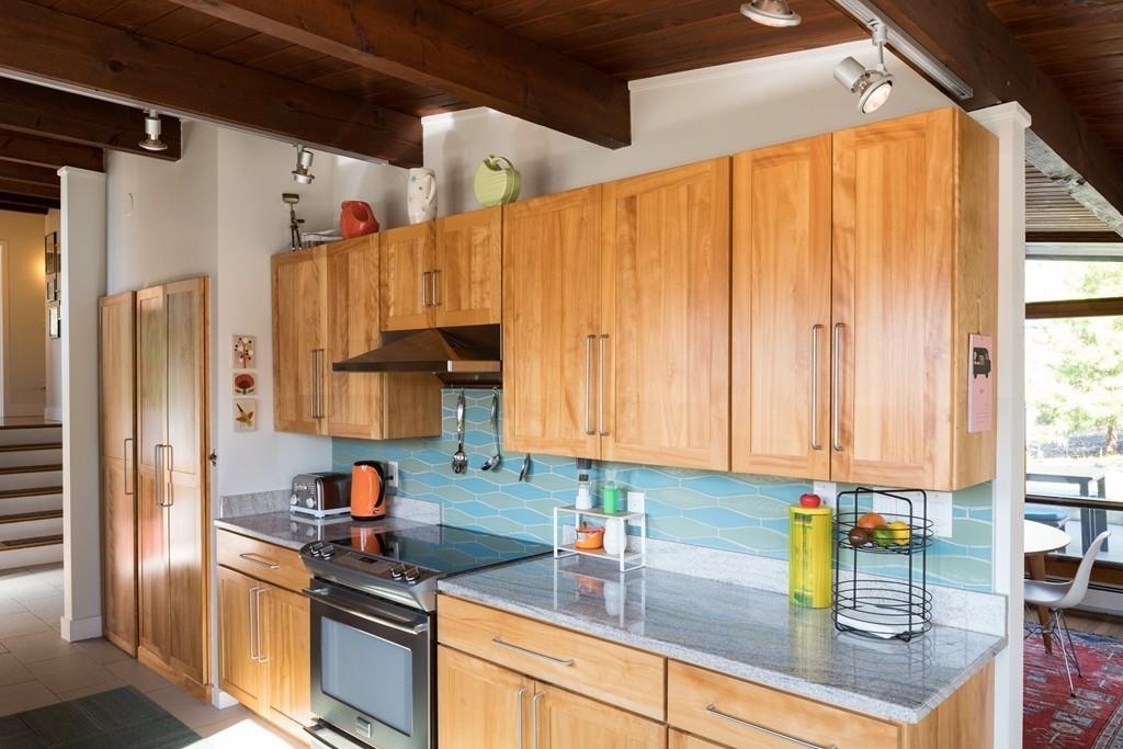 25 Rockwood Road Hingham, MA 02043 - Photo 6 of 34 a kitchen with stainless steel appliances granite countertop a refrigerator and a sink