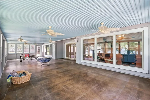 a big room with dining table and chairs