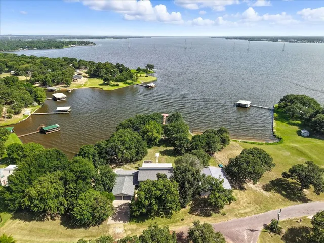 a view of a lake with a yard