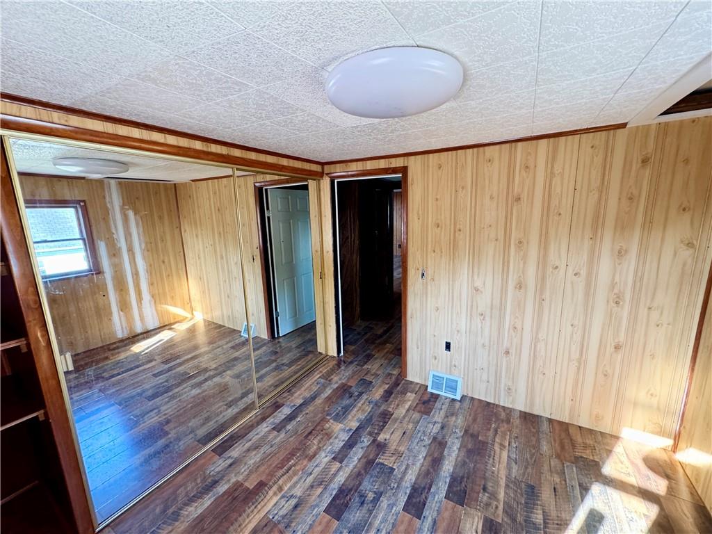 138 Church Street Hopwood, PA 15445 - Photo 24 of 29 a view of an empty room with wooden floor and a window