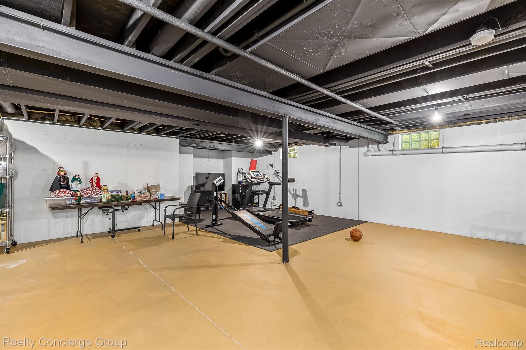 9761 Quail Ridge Run Brighton, MI 48114 - Photo 22 of 30 Basement offers so much space! Padded flr in gym.