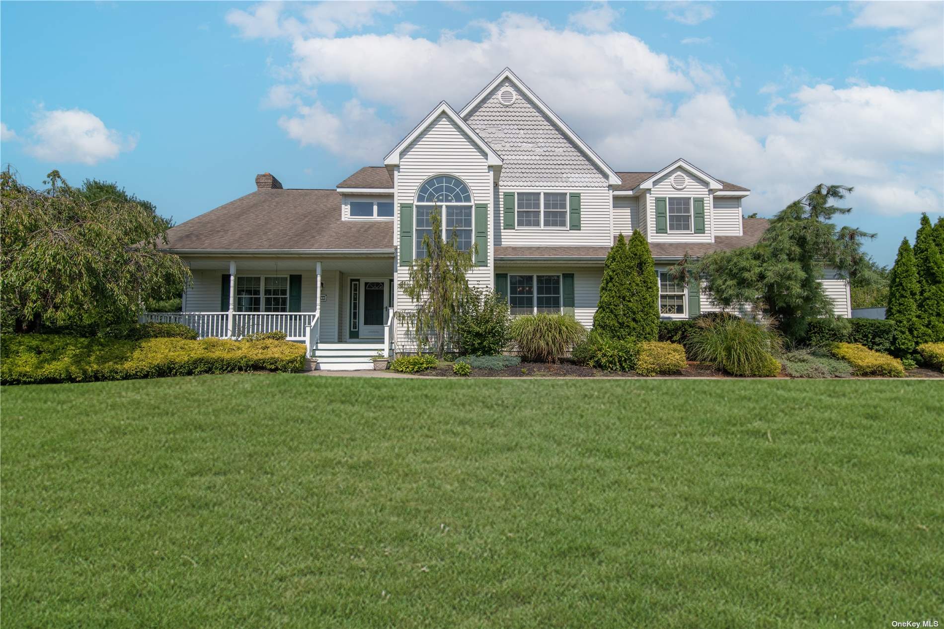 41 Cheryl Drive Shoreham, NY 11786 - Photo 1 of 1 a front view of a house with a yard and trees