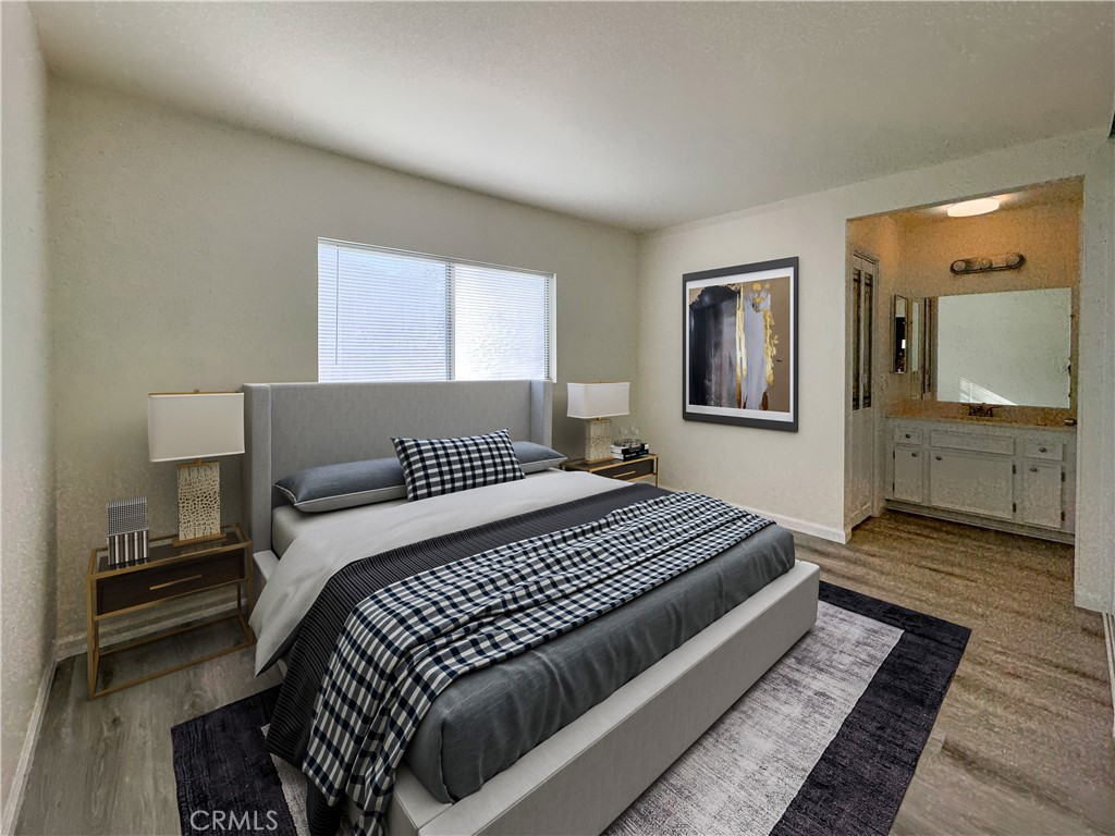 603 Solano Drive Hemet, CA 92545 - Photo 5 of 8 a bedroom with a bed and wooden floor