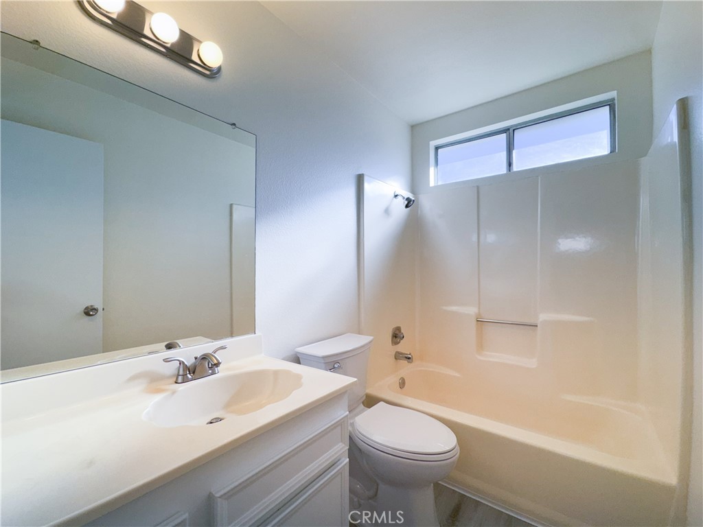 603 Solano Drive Hemet, CA 92545 - Photo 6 of 8 a bathroom with a sink a toilet and shower
