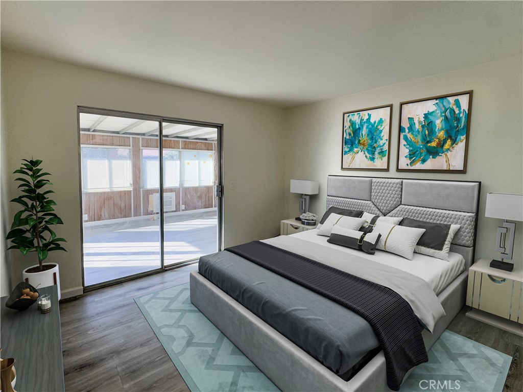 603 Solano Drive Hemet, CA 92545 - Photo 7 of 8 a bedroom with a balcony a bed and a window