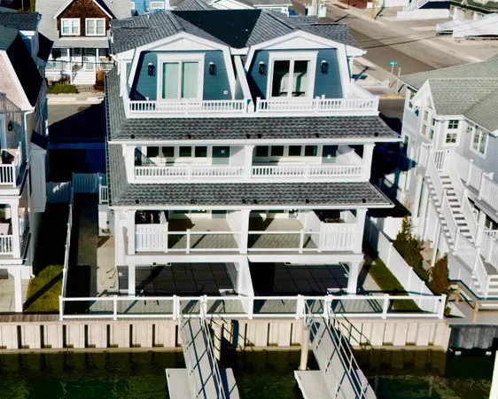 a kitchen with stainless steel appliances granite countertop a stove a refrigerator a kitchen island a sink and a refrigerator