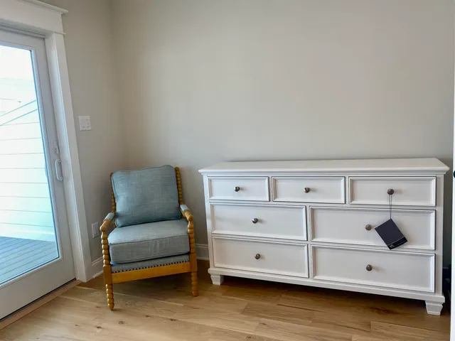 a bedroom with a bed and a night stand