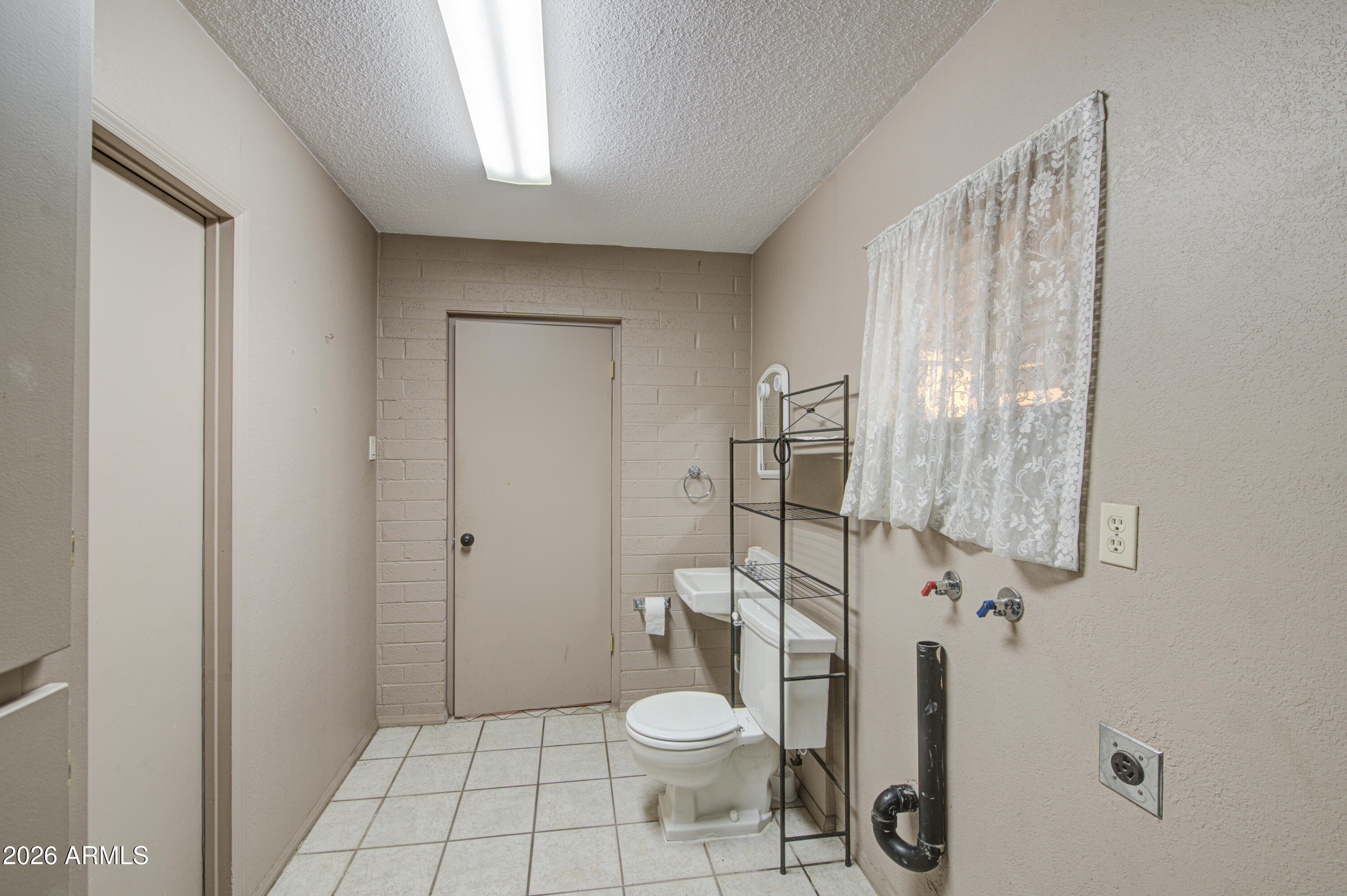 3501 West Royal Palm Road Phoenix, AZ 85051 - Photo 28 of 36 Laundry-Half Bath 2