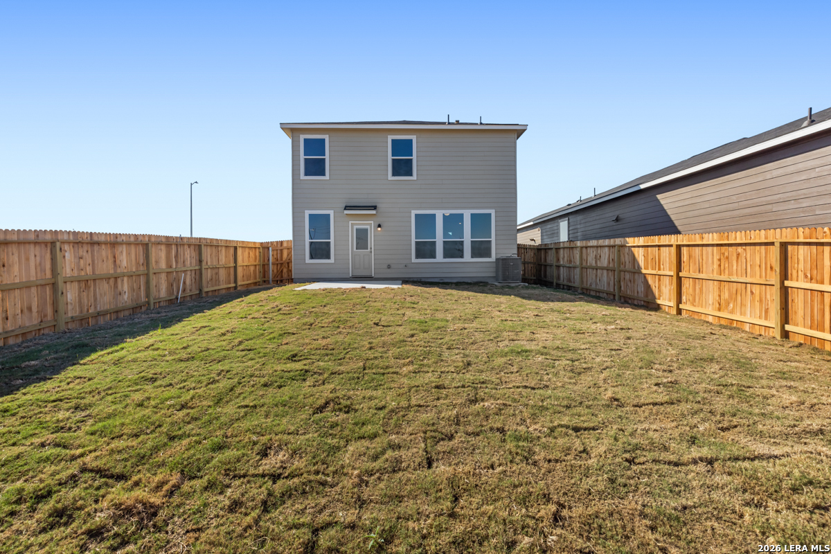 10045 Jagger Avenue Converse, TX 78109 - Photo 7 of 28 a house view with wooden fence