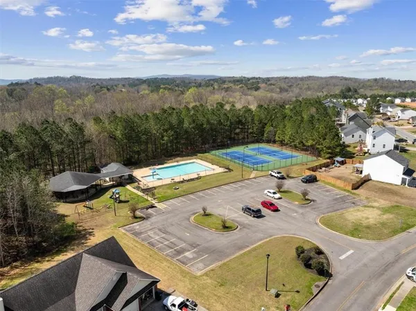 a view of a swimming pool and lounge chair