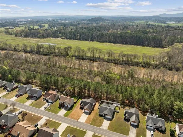 a view of a terrace with lawn chairs