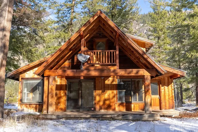 a backyard of a house with large trees