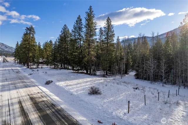 a view of a patio with a table and chairs under an umbrella