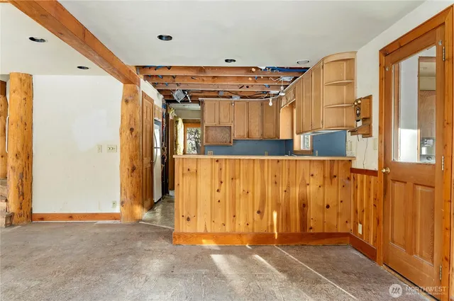 a view of a door with wooden walls