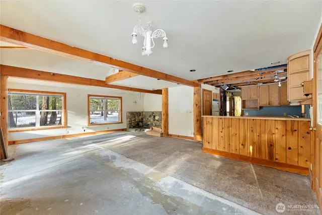 a front view of a house with a large window