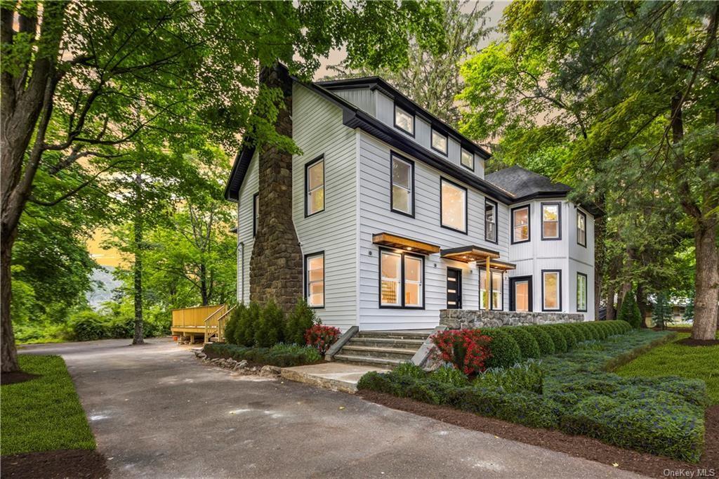 103 Montebello Road Suffern, NY 10901 - Photo 1 of 1 a front view of a house with a yard and trees