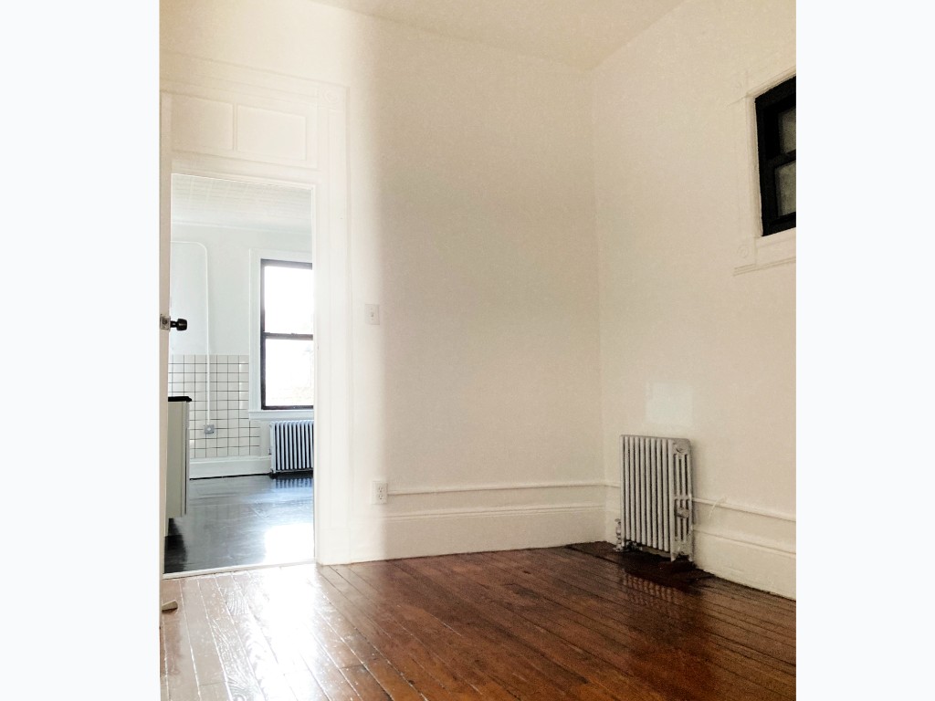 604 Manhattan Avenue, Unit 4R Brooklyn, NY 11222 - Photo 3 of 7 a view of an empty room with wooden floor