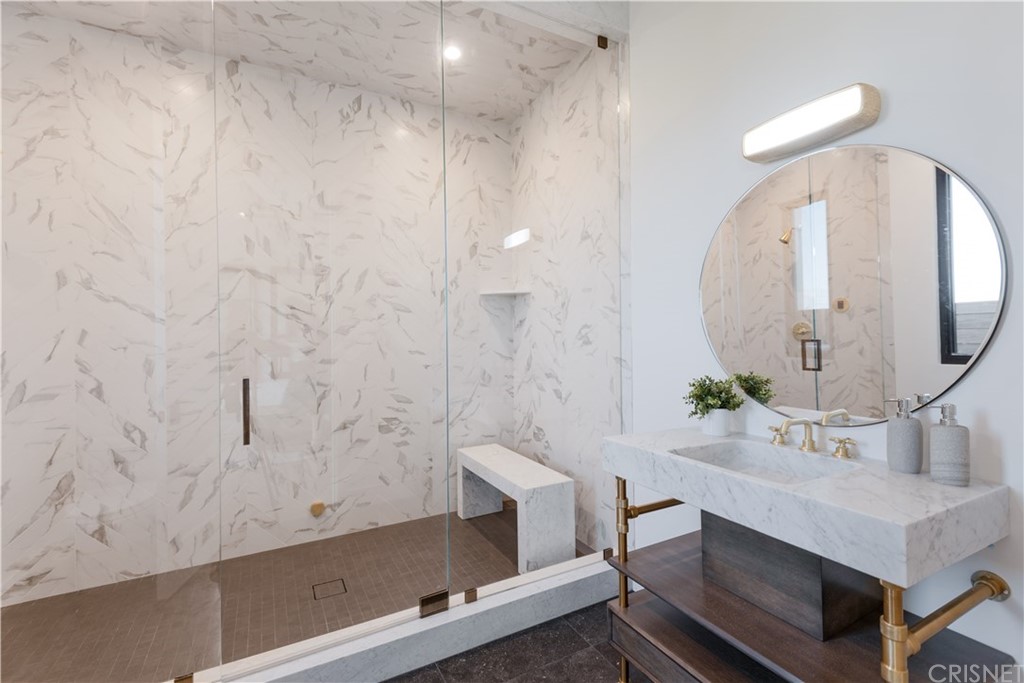 5757 Hoback Glen Road Hidden Hills, CA 91302 - Photo 19 of 47 a bathroom with a sink and a mirror