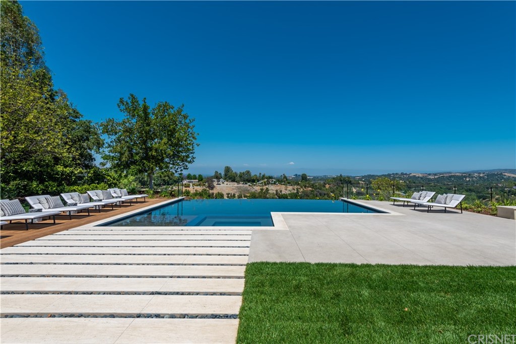5757 Hoback Glen Road Hidden Hills, CA 91302 - Photo 36 of 47 a view of swimming pool with a yard