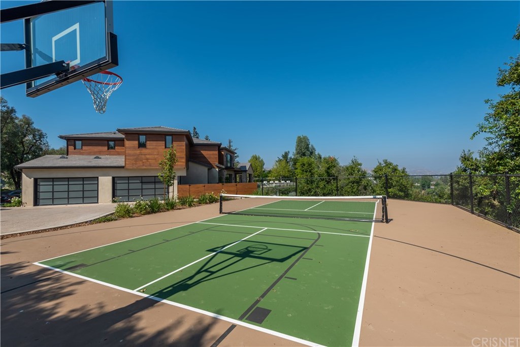 5757 Hoback Glen Road Hidden Hills, CA 91302 - Photo 40 of 47 a view of a white house with a big yard