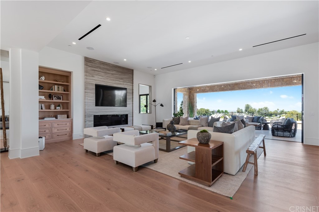 5757 Hoback Glen Road Hidden Hills, CA 91302 - Photo 4 of 47 a living room with furniture and a flat screen tv