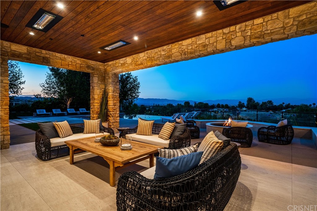 5757 Hoback Glen Road Hidden Hills, CA 91302 - Photo 46 of 47 a outdoor space with patio furniture and a fireplace