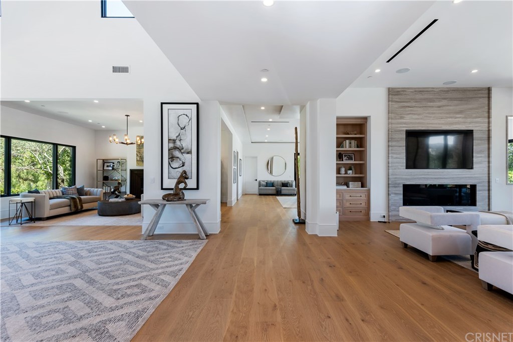 5757 Hoback Glen Road Hidden Hills, CA 91302 - Photo 5 of 47 a living room with furniture and a flat screen tv