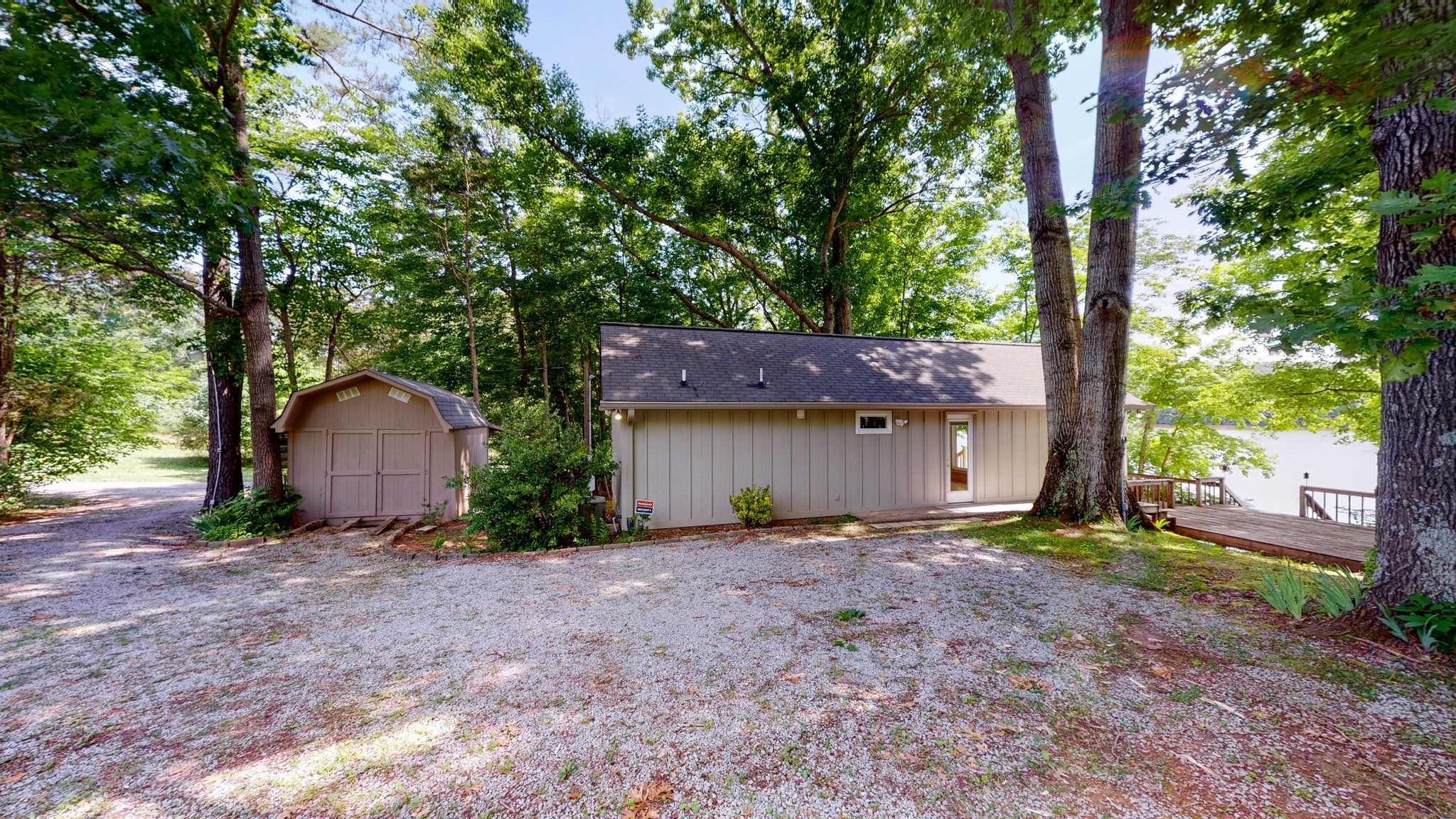 836 Pebble Cove Road Lebanon, TN 37087 - Photo 27 of 31 a big house with large trees and a small yard