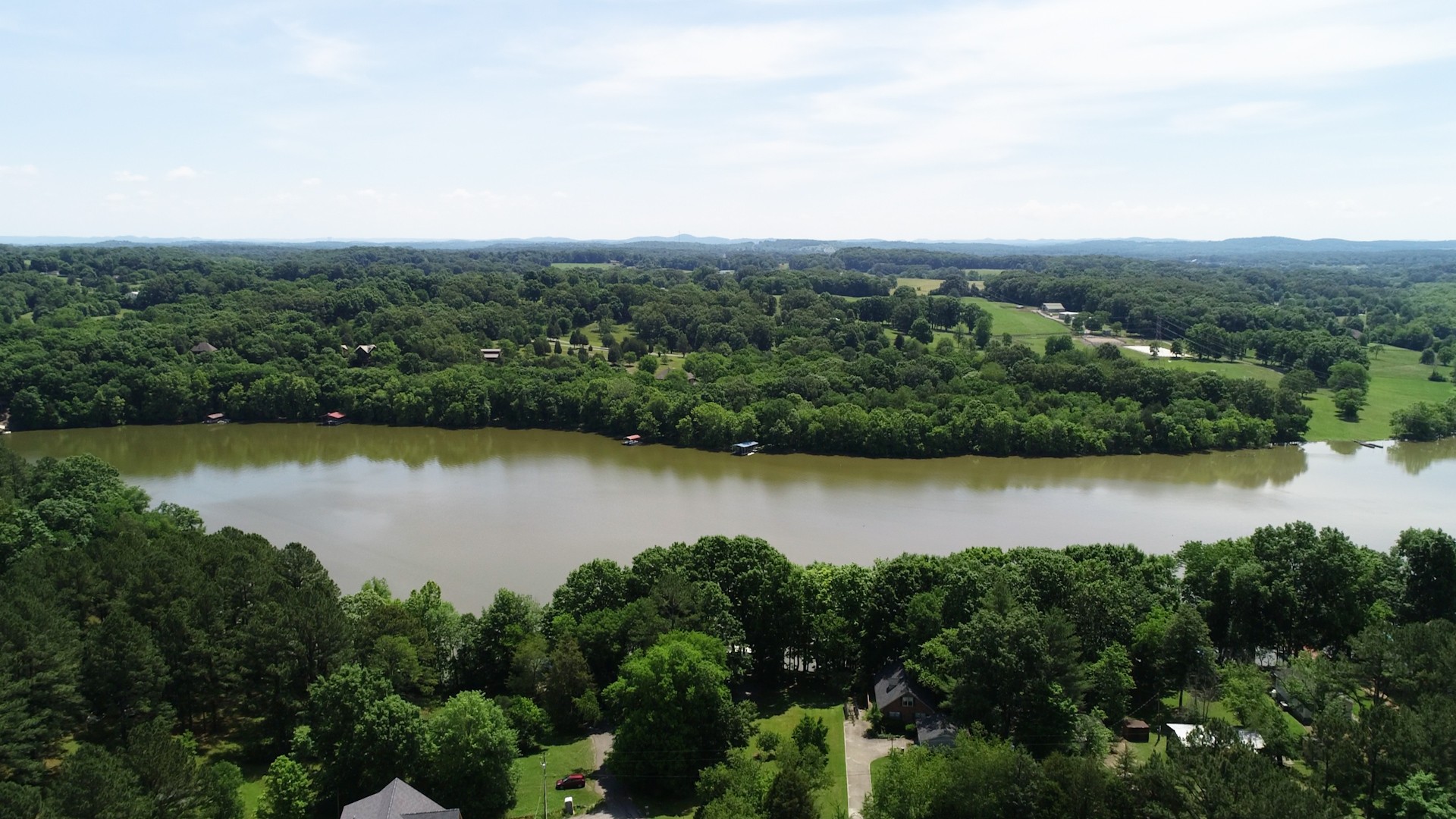 836 Pebble Cove Road Lebanon, TN 37087 - Photo 29 of 31 an aerial view of green landscape with trees houses and lake view