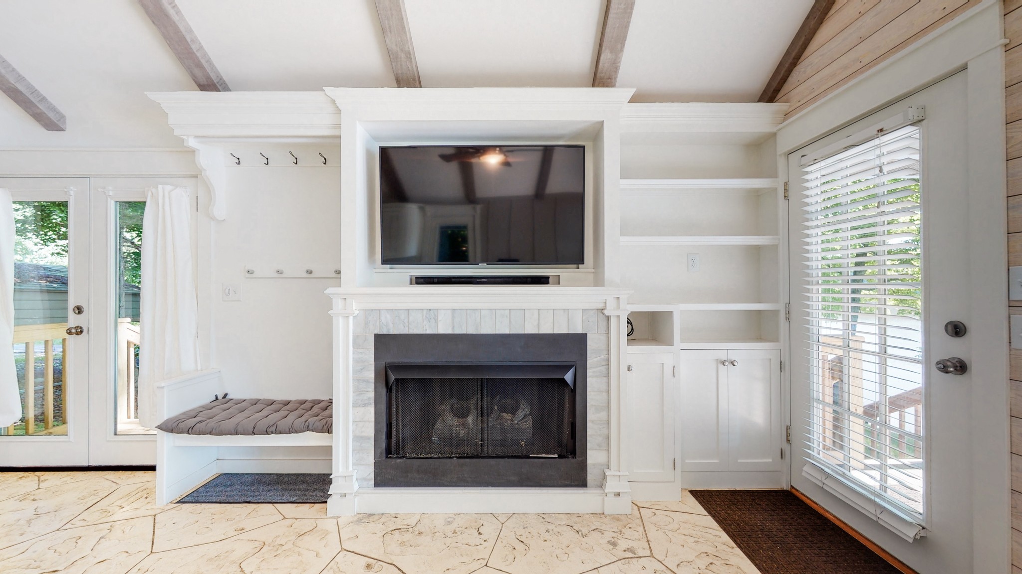 836 Pebble Cove Road Lebanon, TN 37087 - Photo 8 of 31 a living room with a fireplace and a floor to ceiling window