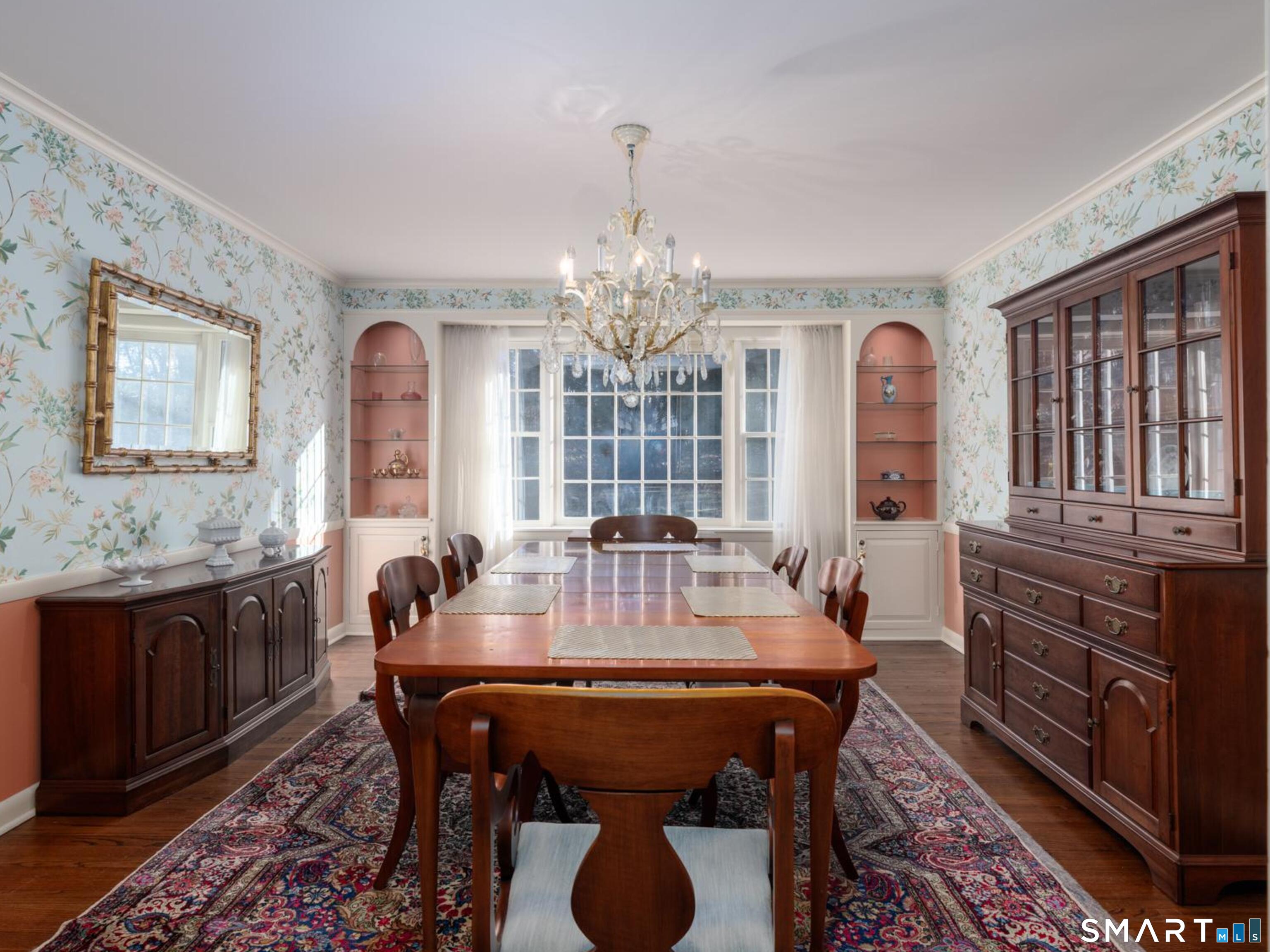 117 Crest Road Middlebury, CT 06762 - Photo 4 of 38 Formal dining room with chair rail, built-in hutches, hardwood floor and beautiful window overlooking the level front yard.