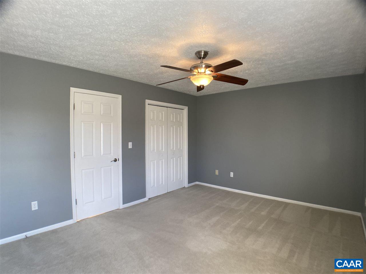 147 Buckboard Road Waynesboro, VA 22980 - Photo 14 of 25 a view of an empty room with a ceiling fan