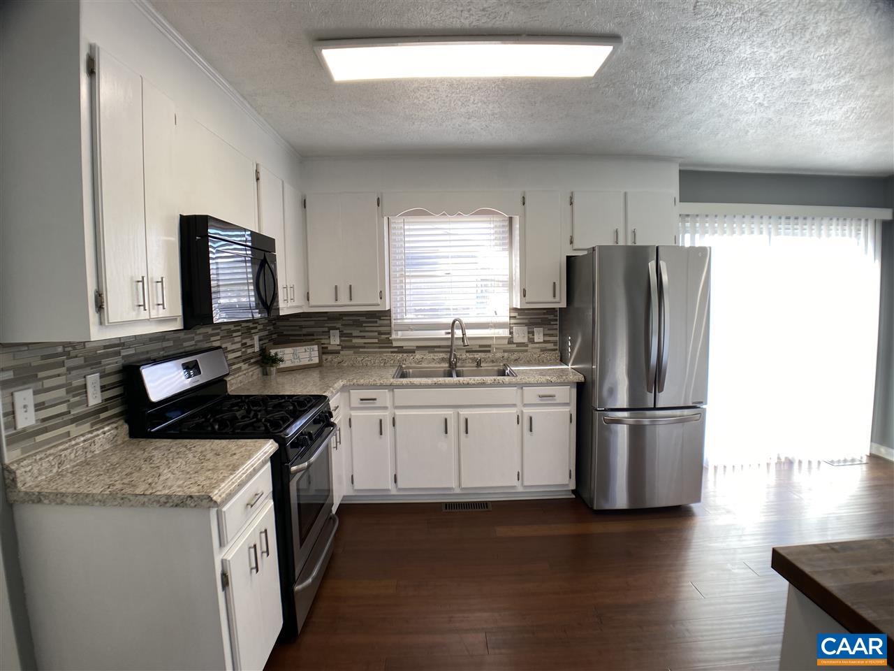 147 Buckboard Road Waynesboro, VA 22980 - Photo 4 of 25 a kitchen with a refrigerator sink and stove