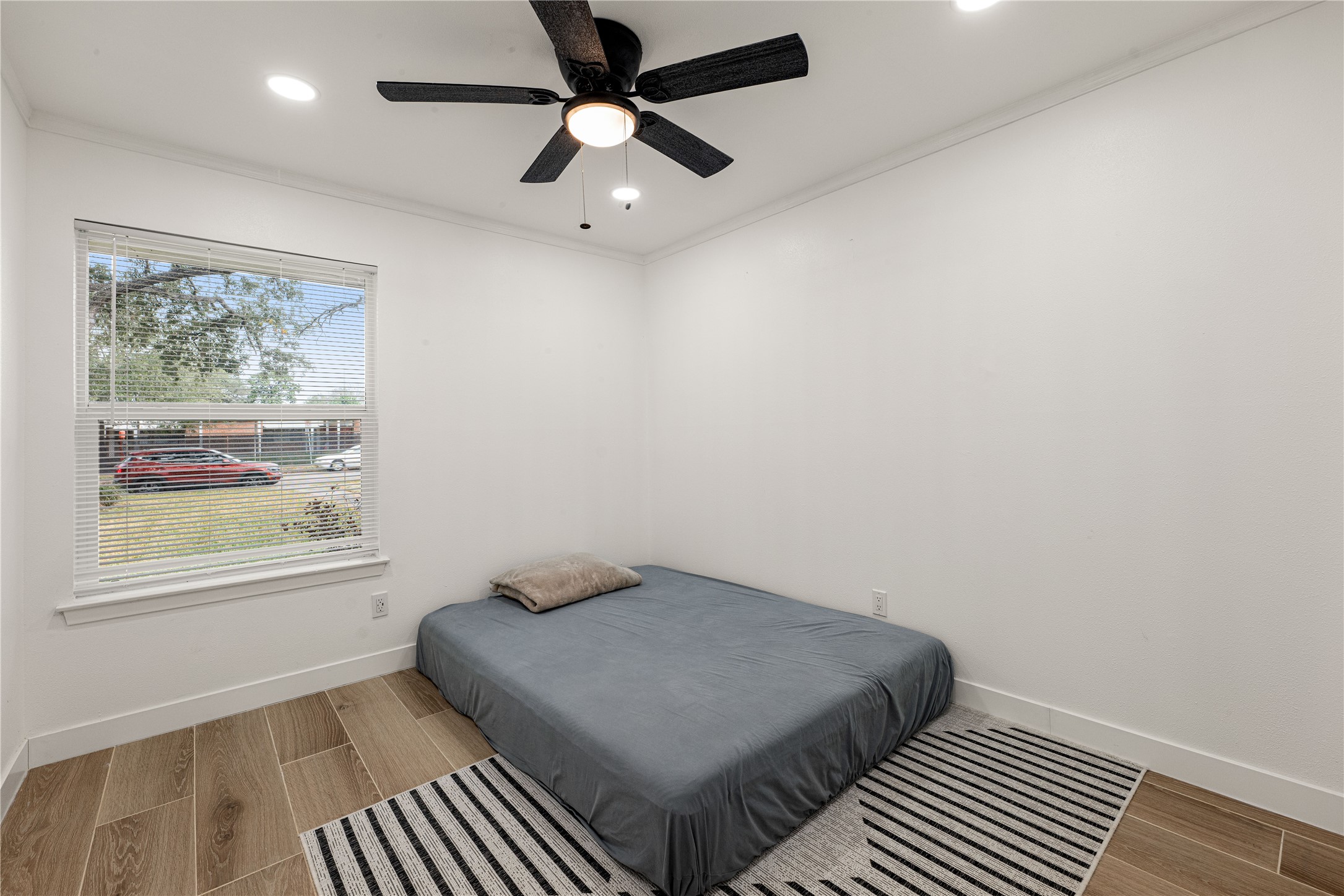 3410 Tanglewilde Street Houston, TX 77063 - Photo 13 of 17 an empty room with windows